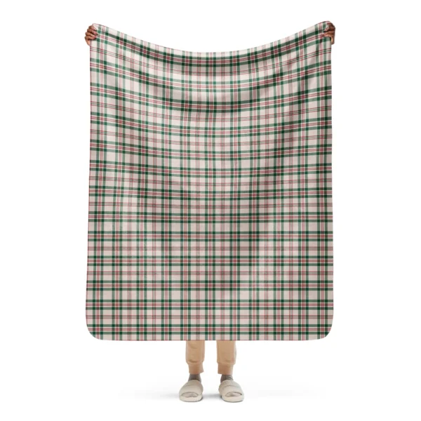 Cream Christmas throw with a forest green and red check, held open at full width in front of a person