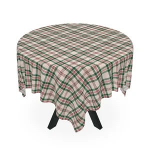 Square cream plaid Christmas tablecloth draped over a round table, corners falling in soft points