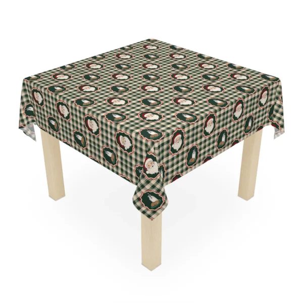 Square wooden table dressed in a gingham Christmas tablecloth with framed Santa portraits