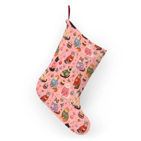 Back of the Christmas cat stocking hanging from its ribbon loop, printed with the same festive cats