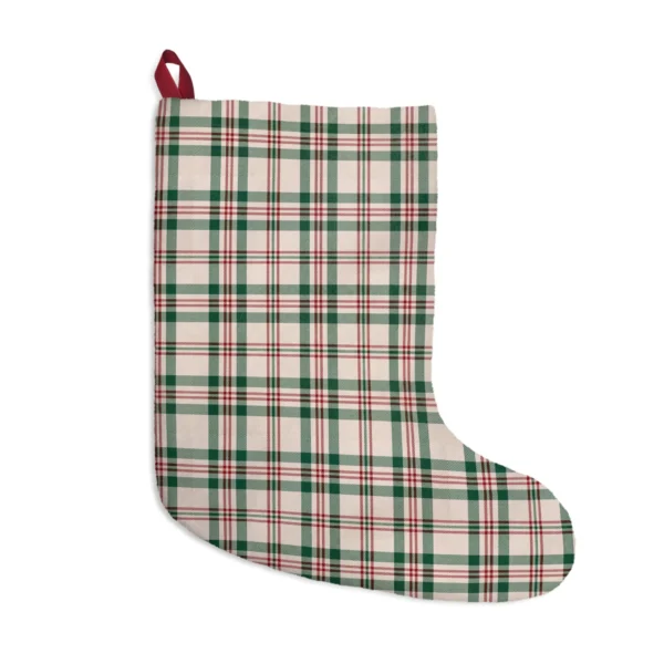 Cream plaid Christmas stocking with green bands and red lines, a red ribbon loop at the top corner