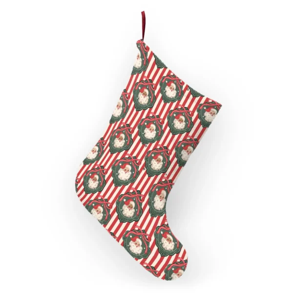 Back of the vintage Santa stocking hanging from its ribbon loop, with the same red stripes and wreaths