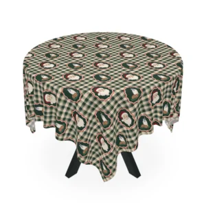 Round table under a green gingham tablecloth with Santa faces and milk-and-cookies medallions