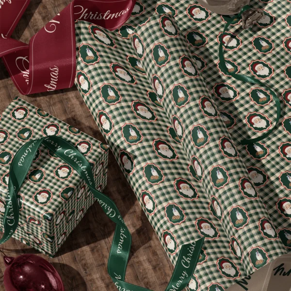 Rolls of Santa milk and cookies gingham gift wrap and a wrapped box with satin ribbons on a wooden floor