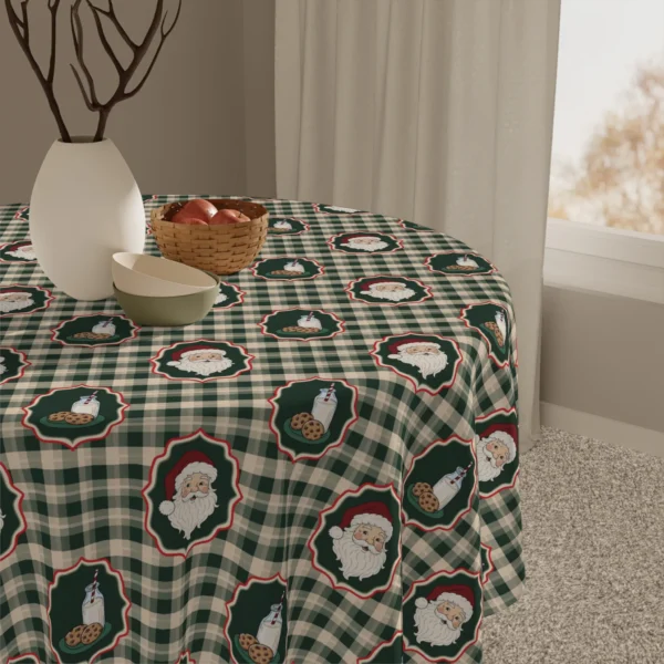 Detail of Santa and cookie medallions on green check fabric next to a vase, a bowl and a basket of apples