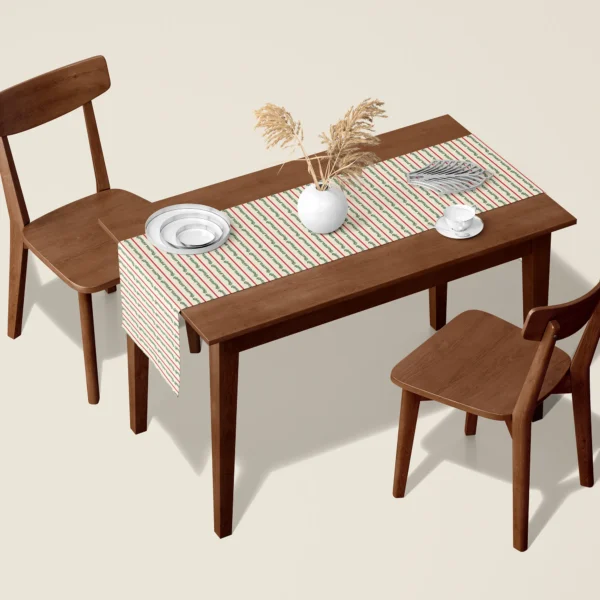 Berry garland stripe Christmas table runner on a walnut dining table with two wooden chairs