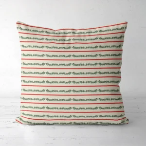 Berry garland stripe Christmas pillow facing forward, red lines and green vines on cream