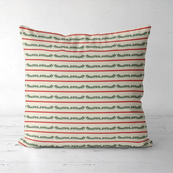 Berry garland stripe Christmas pillow facing forward, red lines and green vines on cream