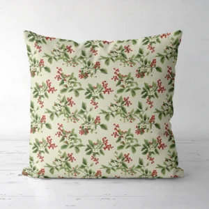 Cream berry sprig pillow facing forward on a white floor