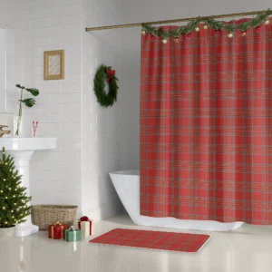 Bright red tartan Christmas shower curtain beside a white tub, with a wreath and a small lit tree