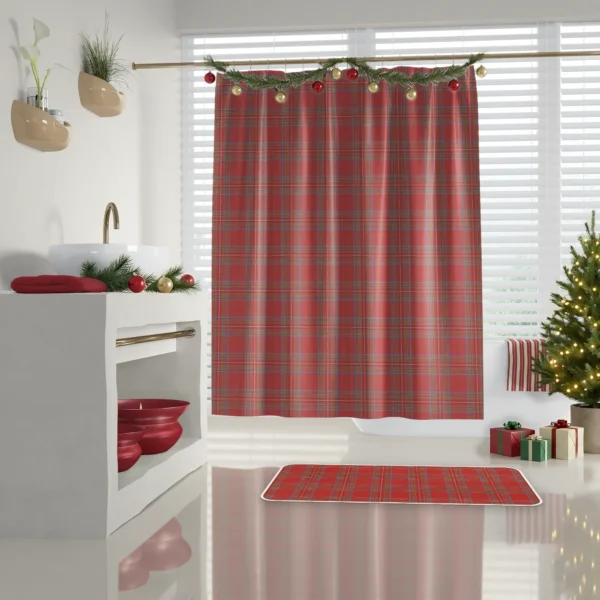Bright red tartan shower curtain in a white bathroom with red towels on a shelf and a decorated tree
