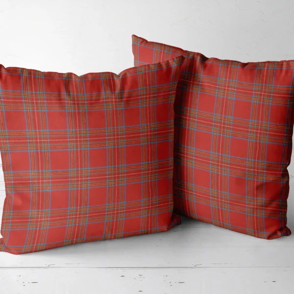 Pair of bright red tartan cushions next to each other