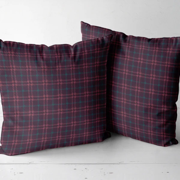 Two burgundy houndstooth plaid throw pillows side by side