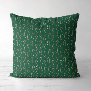 Candy cane Christmas pillow, front view, peppermint canes on deep green