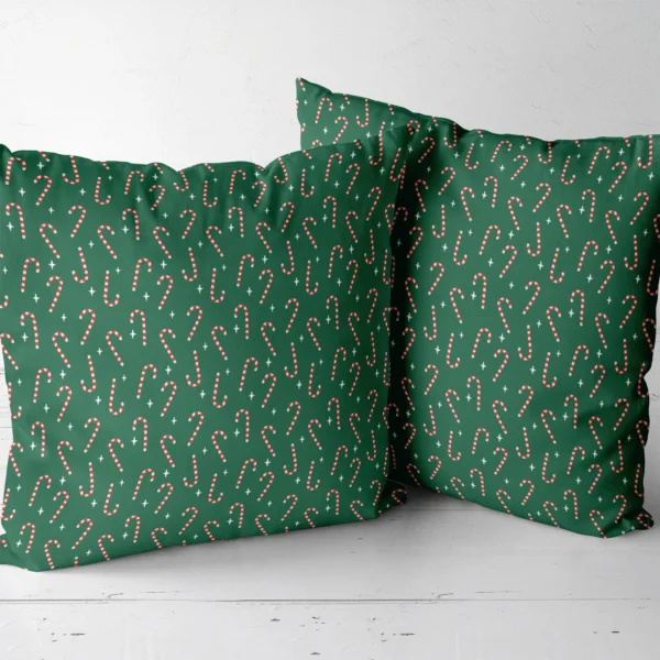 Two candy cane throw pillows side by side