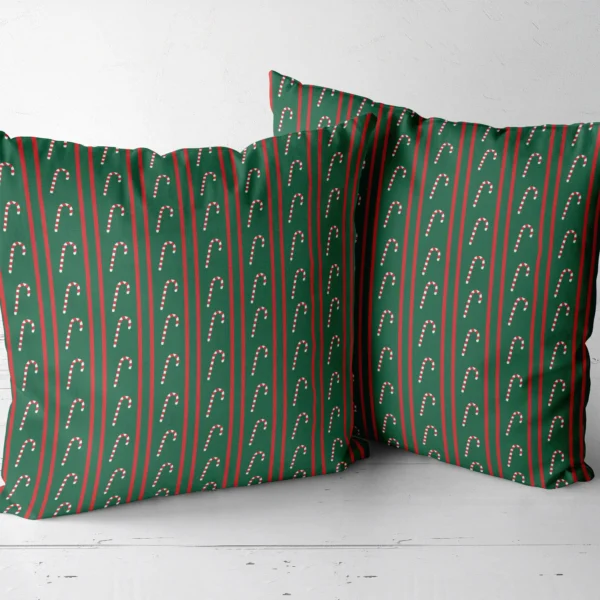 Pair of candy cane stripe throw pillows next to each other