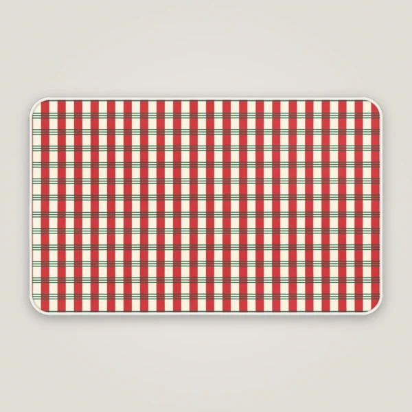 Candy stripe plaid Christmas bath mat with a white bound edge, seen from above