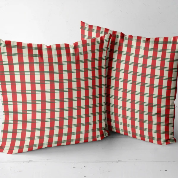 Pair of candy stripe plaid throw pillows next to each other