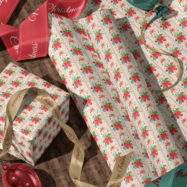 Rolls of red bow bouquet gift wrap and a wrapped box with satin ribbons on a wooden floor