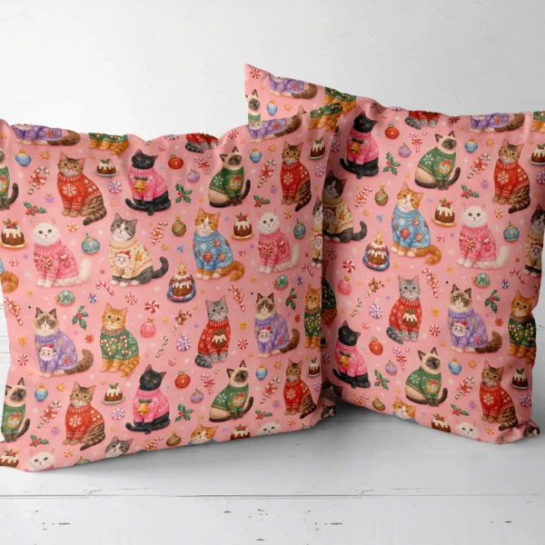 Two cat sweater throw pillows side by side