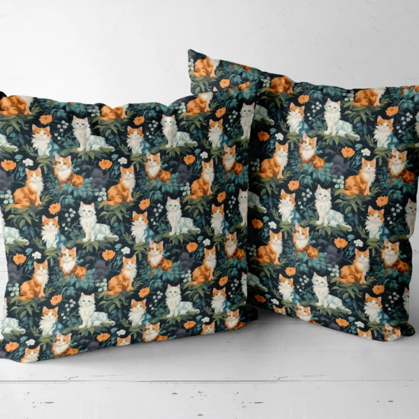Two throw pillows with a cats and leaves on forest green print side by side