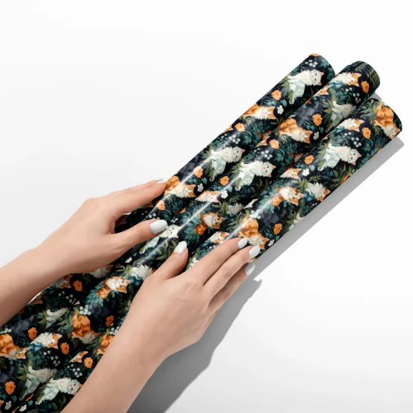 Hands smoothing three rolls of forest green cat wrapping paper on a white table