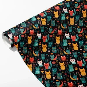 Roll of black wrapping paper with mustard, teal and coral folk-style cats, partly unrolled on white