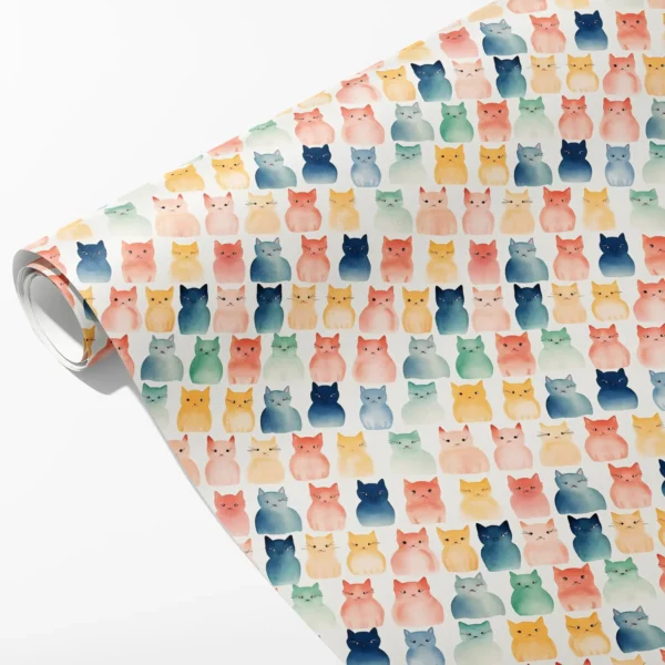 Roll of cream wrapping paper with blush, navy, mustard and sage watercolor-style cats, partly unrolled on white