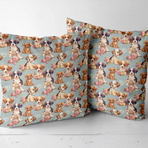 Two throw pillows with a puppies and pink roses on dusty blue print side by side