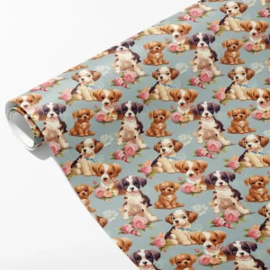 Roll of dusty blue wrapping paper with puppies in blue collar bows among pink roses, partly unrolled on white