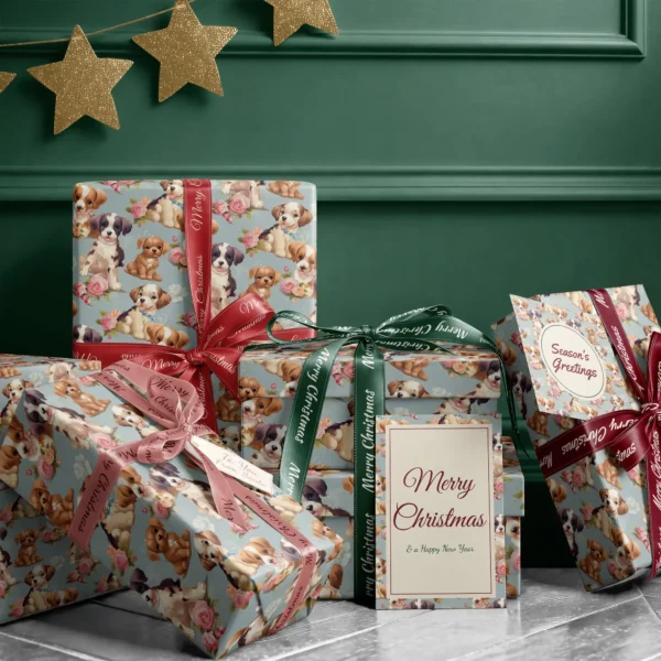 Stack of presents in dusty blue puppy and rose paper with ribbons and a Merry Christmas card by a dark green wall