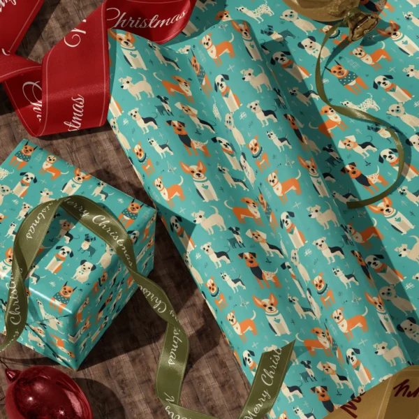 A sheet of aqua retro dog gift wrap and a wrapped box with red and green satin ribbons on a wooden floor