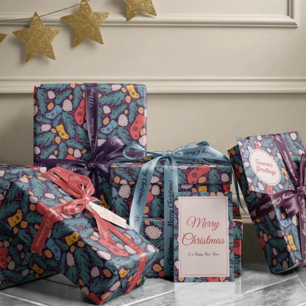 Stack of presents in plum stocking paper with ribbons and a Merry Christmas card by a beige wall