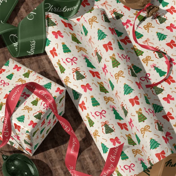 Rolls of Christmas tree and bow gift wrap and a wrapped box with satin ribbons on a wooden floor