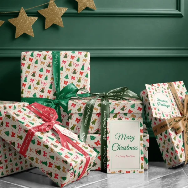 Stack of presents in Christmas tree and bow paper with ribbons and a Merry Christmas card by a dark green wall