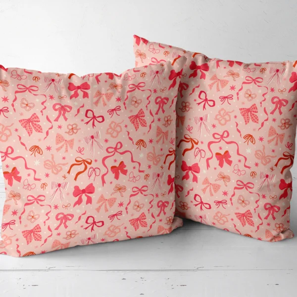 Pair of coquette bow throw pillows next to each other