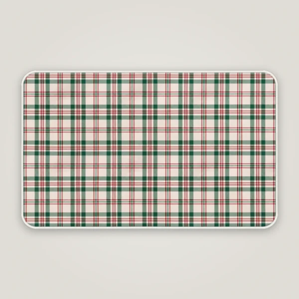 Cream plaid Christmas bath mat with a white bound edge, seen from above