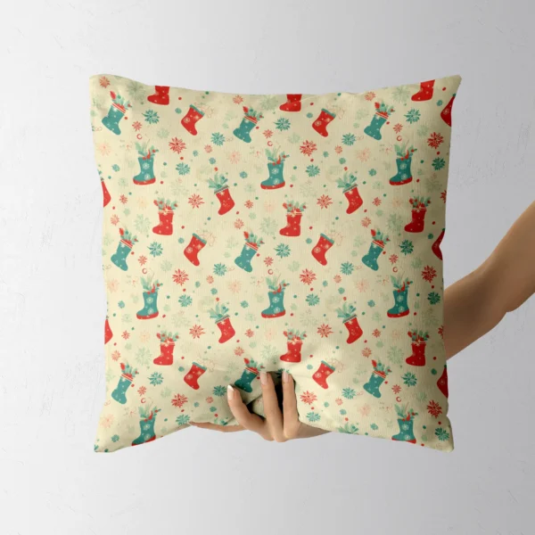 Stocking print cushion in cream resting in a hand