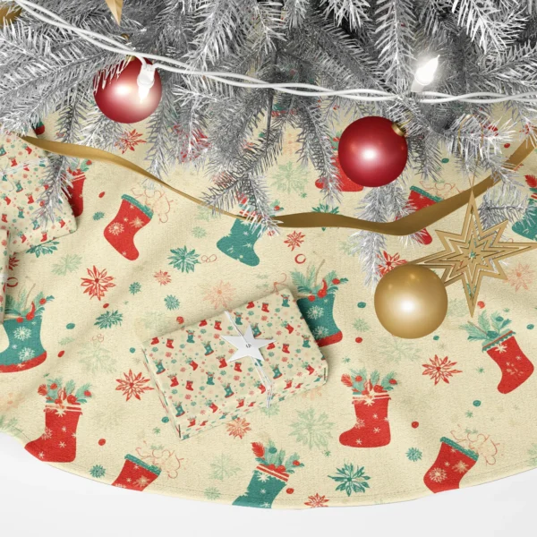 Close-up of a red stocking with a teal cuff and pine sprigs beside a starburst flake