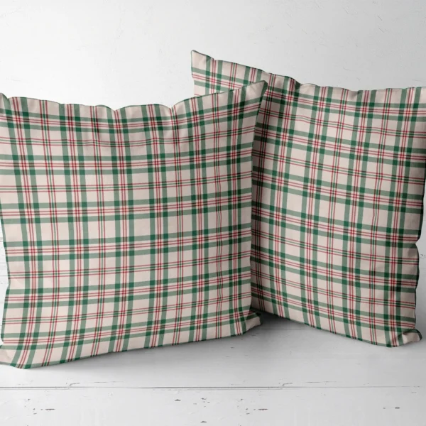 Two cream plaid throw pillows placed side by side