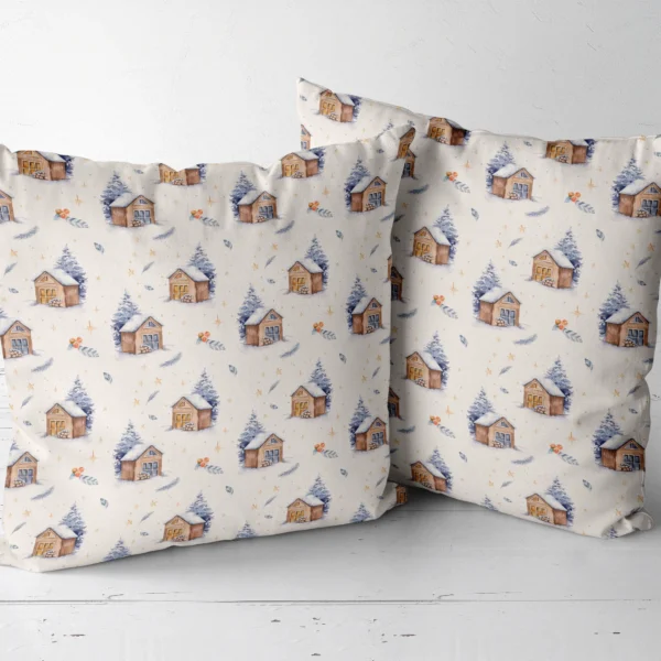 Pair of cream snowy cabin throw pillows side by side