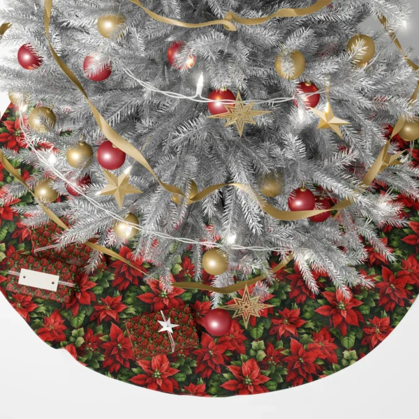 Dark green poinsettia skirt under a lit Christmas tree surrounded by wrapped gifts