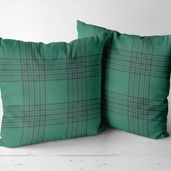 Two emerald windowpane throw pillows side by side