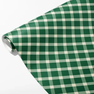 Roll of deep green, sage and cream gingham check wrapping paper, partly unrolled on white