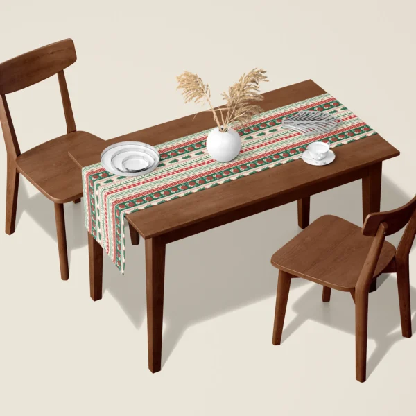 Folk border Christmas table runner on a walnut dining table with two wooden chairs