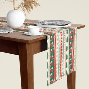 Folk border Christmas table runner hanging over the end of a walnut dining table, close-up