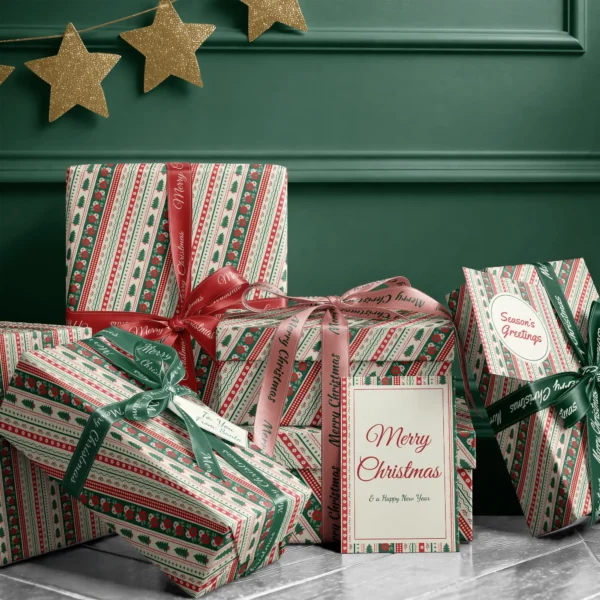 Stack of presents in folk border paper with ribbons and a Merry Christmas card by a dark green wall