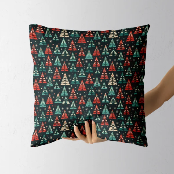 Hand holding the square folk tree pillow with its black ground