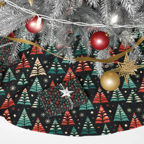 Close-up of the folk print: striped red and leaf-edged teal trees with cream starbursts on black