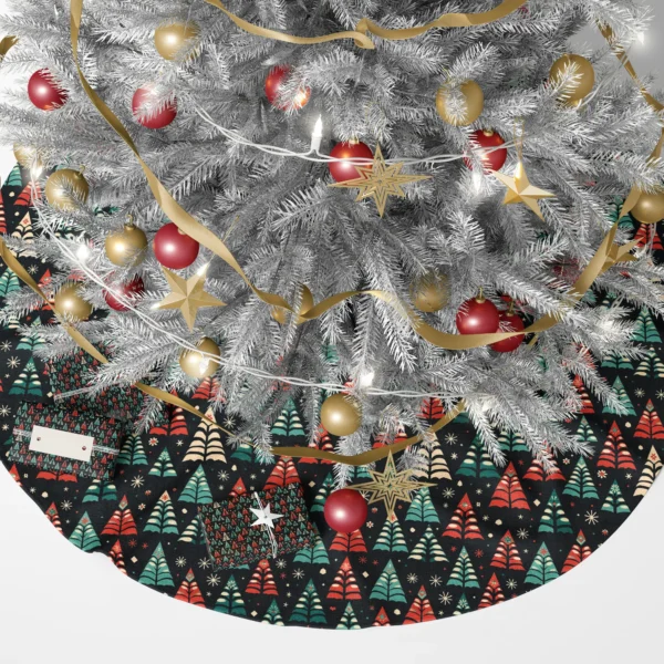 Folk tree skirt in black under a lit Christmas tree, wrapped gifts piled around